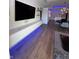 An open floor plan featuring a lounge area, dining area, and kitchen with custom LED lighting at 802 N Meridian St # 205, Indianapolis, IN 46204