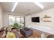 Bright living room with hardwood floors, large windows, and modern decor throughout at 802 N Meridian St # 205, Indianapolis, IN 46204