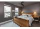 Cozy bedroom with hardwood floors, neutral walls, and large windows for ample natural light at 802 N Meridian St # 205, Indianapolis, IN 46204