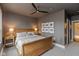 Comfortable bedroom with neutral walls, wooden furniture, and windows offering city views at 802 N Meridian St # 205, Indianapolis, IN 46204
