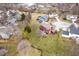 The backyard featuring a patio and mature landscaping near the lake at 8238 Armadale Ct, Indianapolis, IN 46236