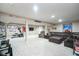 Finished basement with a large seating area, workout equipment, and recreational space at 8238 Armadale Ct, Indianapolis, IN 46236