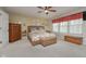 Comfortable bedroom with natural light, a ceiling fan, and a decorative accent window at 8238 Armadale Ct, Indianapolis, IN 46236