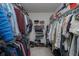 Walk-in closet with ample shelving and hanging space for organized storage at 8238 Armadale Ct, Indianapolis, IN 46236
