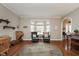Bright living room with hardwood floors, bay window, elegant furnishings, and neutral paint at 8238 Armadale Ct, Indianapolis, IN 46236
