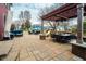 Enjoy outdoor living on this beautiful patio with pergola, dining, and ample lounge seating at 8238 Armadale Ct, Indianapolis, IN 46236
