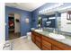 Bathroom boasts double sinks, tile floor, walk-in closet, and shower-tub combo at 8430 Templederry Dr, Brownsburg, IN 46112