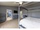 Spacious bedroom with a four-poster bed, blue walls, and en-suite bathroom access at 8430 Templederry Dr, Brownsburg, IN 46112
