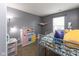 Charming bedroom with a playful decor including bunk beds and a cute play kitchen at 8430 Templederry Dr, Brownsburg, IN 46112
