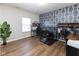 Bedroom with desk, chair, stylish blue wallpaper and dog kennel at 8430 Templederry Dr, Brownsburg, IN 46112
