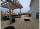 Spacious wooden deck featuring a pergola and outdoor seating, perfect for entertaining at 8430 Templederry Dr, Brownsburg, IN 46112