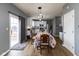 Eat-in kitchen dining area filled with natural light and leading to white kitchen at 8430 Templederry Dr, Brownsburg, IN 46112