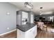 Spacious eat-in kitchen with island and connecting to the living room and dining area at 8430 Templederry Dr, Brownsburg, IN 46112
