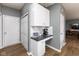 Bright office area with white cabinets, a desk, and access to storage at 8430 Templederry Dr, Brownsburg, IN 46112