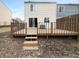 Backyard featuring a wooden deck with staircase and views of yard at 9435 Timber View Dr, Indianapolis, IN 46250