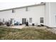 A backyard patio with a grill, seating, and a well-maintained lawn at 9769 Green Knoll Dr, Noblesville, IN 46060