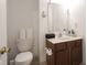 Bathroom with a vanity, toilet, and large mirror and an anchor decoration at 9769 Green Knoll Dr, Noblesville, IN 46060