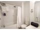 Bright bathroom featuring a shower-tub combo, crisp white tiling and modern fixtures at 9769 Green Knoll Dr, Noblesville, IN 46060