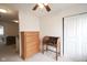 A bedroom featuring a dresser, desk, and neutral colored walls and carpet at 9769 Green Knoll Dr, Noblesville, IN 46060