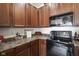 A kitchen featuring stainless steel appliances, wood cabinets, and countertops at 9769 Green Knoll Dr, Noblesville, IN 46060