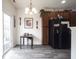 A eat-in kitchen featuring stainless steel appliances, wood cabinets, and light gray wood-look floors at 9769 Green Knoll Dr, Noblesville, IN 46060