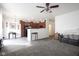 Open concept living room, transitioning from light gray flooring to carpet, with view of kitchen at 9769 Green Knoll Dr, Noblesville, IN 46060