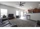 Open concept living room featuring light gray flooring, carpet, and access to the kitchen at 9769 Green Knoll Dr, Noblesville, IN 46060