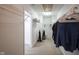Spacious walk-in closet features wire shelving and ample hanging space for clothing at 9769 Green Knoll Dr, Noblesville, IN 46060