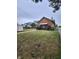 Spacious backyard with a wooden deck, partial fence, and plenty of room for outdoor enjoyment at 1001 S Anderson St, Elwood, IN 46036