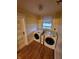A cozy laundry area featuring modern washer and dryer units with a window providing natural light at 1001 S Anderson St, Elwood, IN 46036