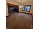 Spacious living room featuring a decorative chandelier and traditional trim at 1001 S Anderson St, Elwood, IN 46036