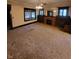 Spacious living room featuring carpet, a decorative fireplace, and vintage detailing at 1001 S Anderson St, Elwood, IN 46036