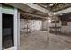 Unfinished basement with exposed piping, concrete floors, and exposed beams at 1023 W 7Th St, Anderson, IN 46016