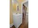 Bathroom vanity featuring a white cabinet, neutral walls, and hardwood floors at 1023 W 7Th St, Anderson, IN 46016