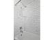 Elegant bathroom featuring a white tiled shower and modern fixtures at 1023 W 7Th St, Anderson, IN 46016