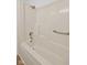 A neutral bathroom highlighting a bright white shower and tub combination at 1023 W 7Th St, Anderson, IN 46016