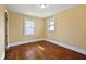 Neutral bedroom featuring beautiful hardwood floors and bright natural light at 1023 W 7Th St, Anderson, IN 46016