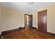Bedroom with hardwood floors, neutral walls and view into the hallway at 1023 W 7Th St, Anderson, IN 46016