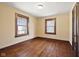Neutral bedroom featuring beautiful hardwood floors and bright natural light at 1023 W 7Th St, Anderson, IN 46016