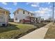 Street view of a two-story home with a brick-accented porch and well-maintained lawn at 1023 W 7Th St, Anderson, IN 46016