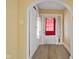 Inviting foyer featuring wood-look flooring, closet, and archway that adds character to the home's entrance at 1023 W 7Th St, Anderson, IN 46016