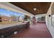 Covered front porch with brick columns offering a cozy outdoor seating area and neighborhood views at 1023 W 7Th St, Anderson, IN 46016