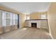 Bright living room with a decorative fireplace, built-in shelving, and ample natural light at 1023 W 7Th St, Anderson, IN 46016