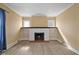 Bright living room features a decorative fireplace, built-in shelving and modern flooring at 1023 W 7Th St, Anderson, IN 46016