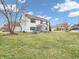 A large backyard with healthy green grass, surrounded by a privacy fence at 10827 Putnam Pl, Carmel, IN 46032