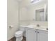 Cozy powder room features a white vanity at 10827 Putnam Pl, Carmel, IN 46032