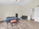 Spacious bedroom features wood floors, vaulted ceiling, and ensuite bathroom at 10827 Putnam Pl, Carmel, IN 46032
