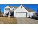 Charming two-story home featuring a two-car garage, white siding, and well-maintained landscaping at 10827 Putnam Pl, Carmel, IN 46032
