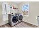 Laundry room featuring newer front-load washer and dryer at 10827 Putnam Pl, Carmel, IN 46032