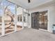 Cozy screened porch with a ceiling fan, sliding door access to the home, and view of backyard at 10827 Putnam Pl, Carmel, IN 46032
